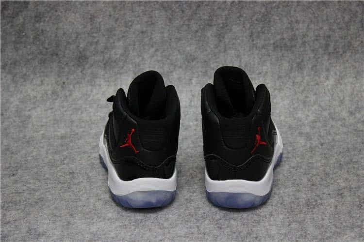 Air Jordan 11 Kids Black Upper White Sole Red Logo 4