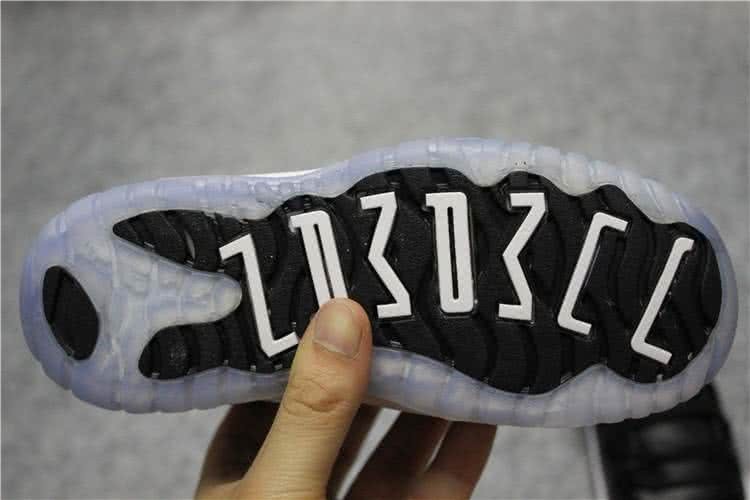 Air Jordan 11 Kids Black Upper White Sole Red Logo 9